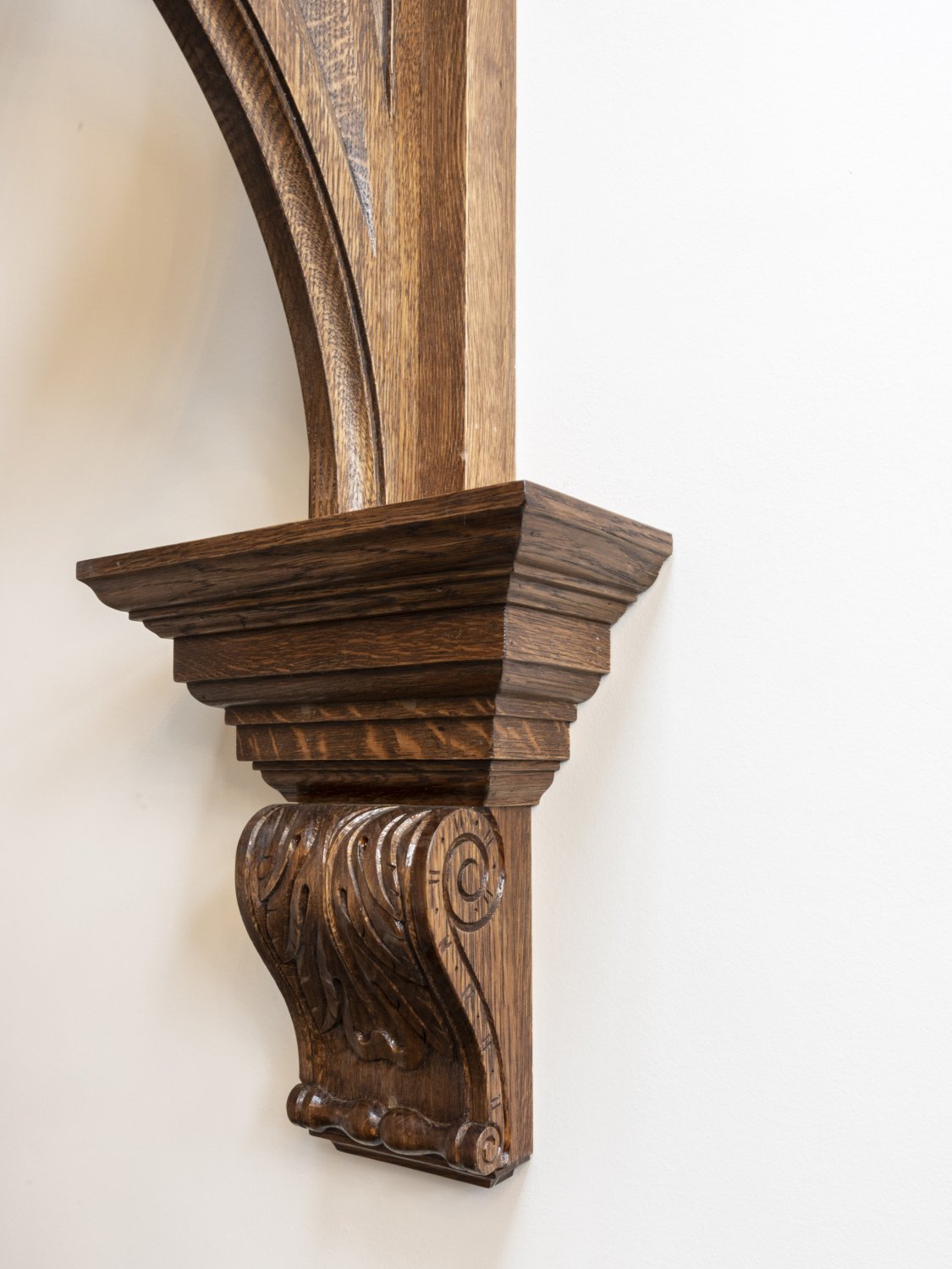 Detail of the hand carved acanthus wall bracket, in solid oak